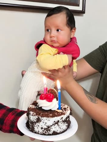 Baby with a birthday cake