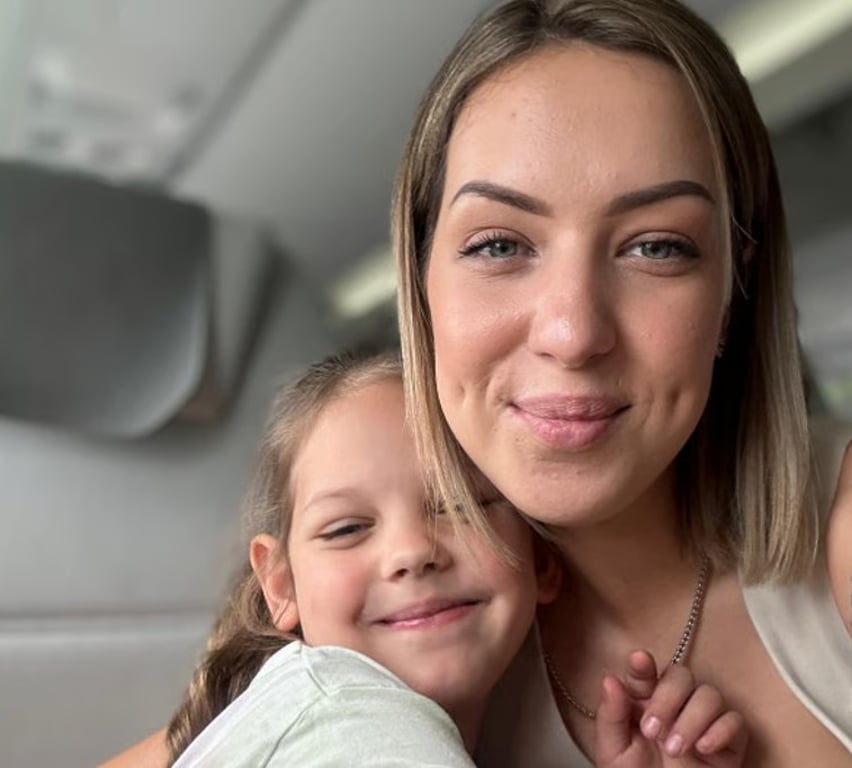 Mother and daughter hugging