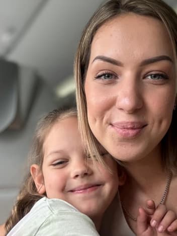 Mother and daughter hugging