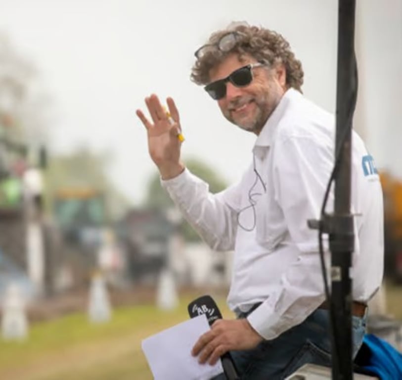 Man waving at a community event