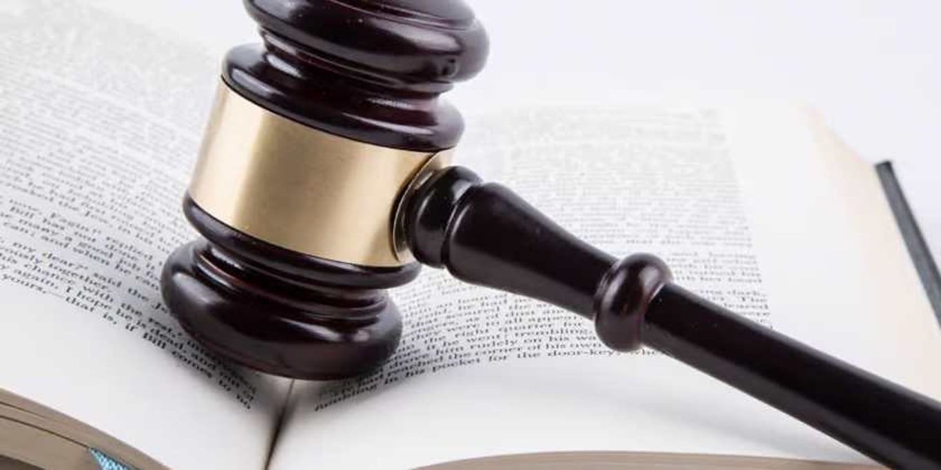 Gavel resting on an open law book