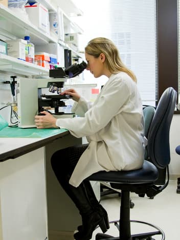 Lab technician with test tubes