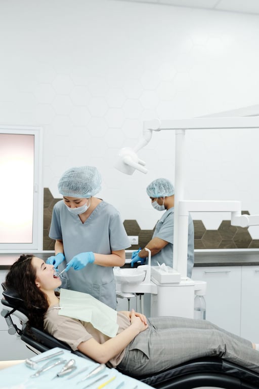 Dentist treating a patient in the chair