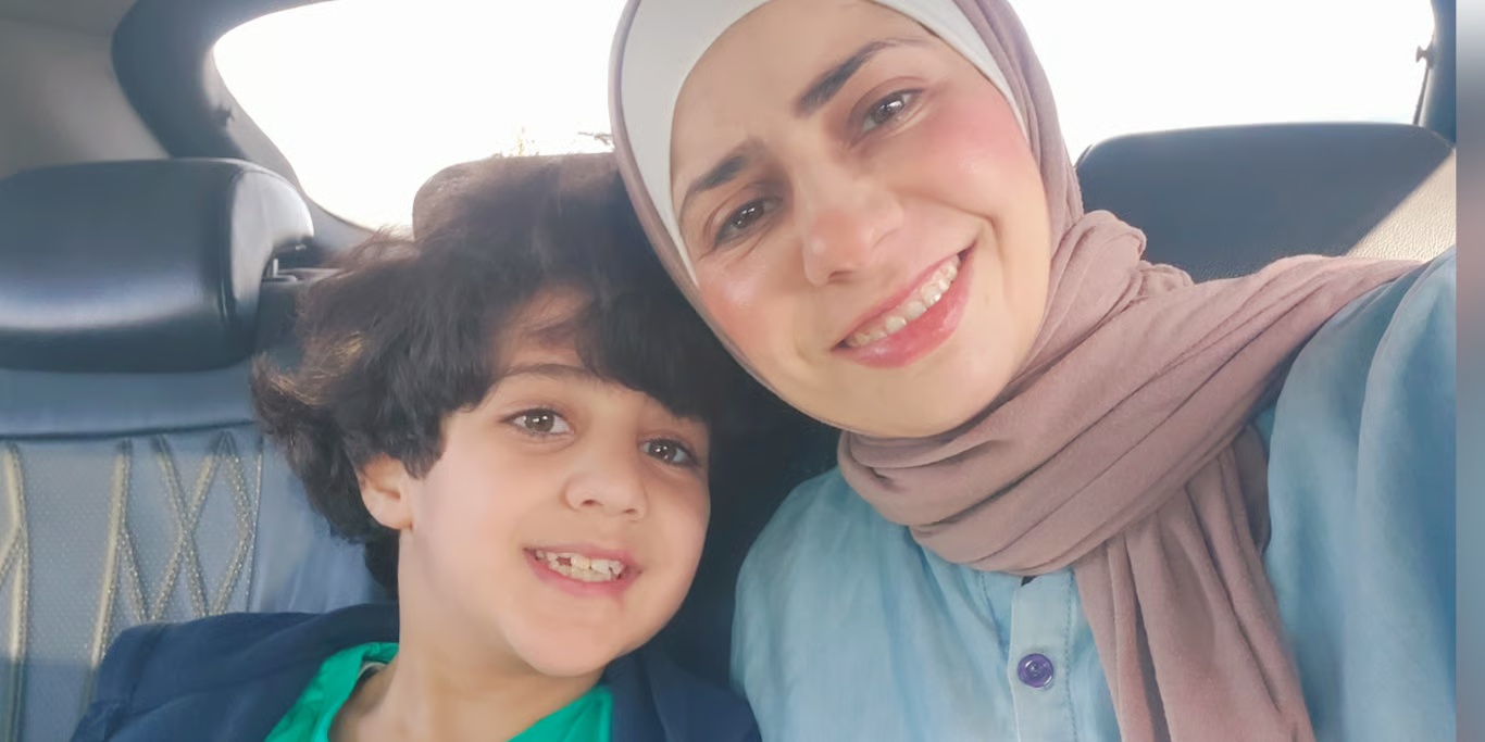Mother and son smiling together