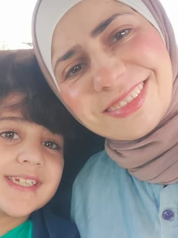 Mother and son smiling together