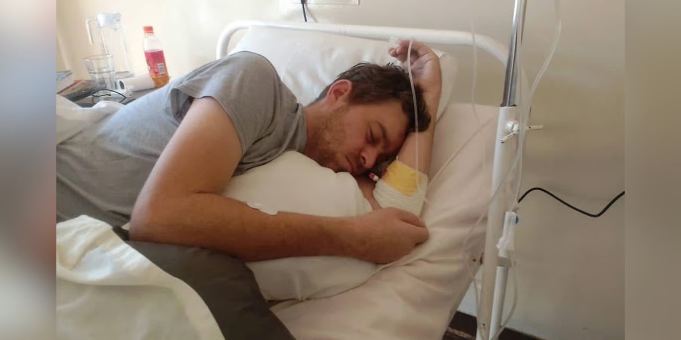 Man resting in a hospital bed