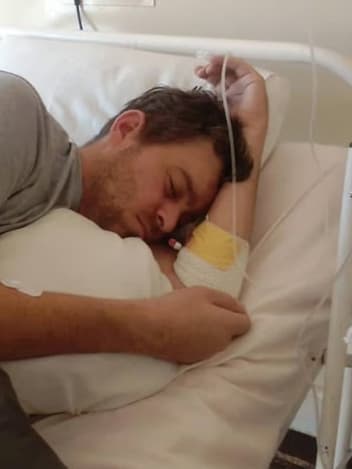 Man resting in a hospital bed