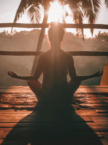 Woman meditating outdoors