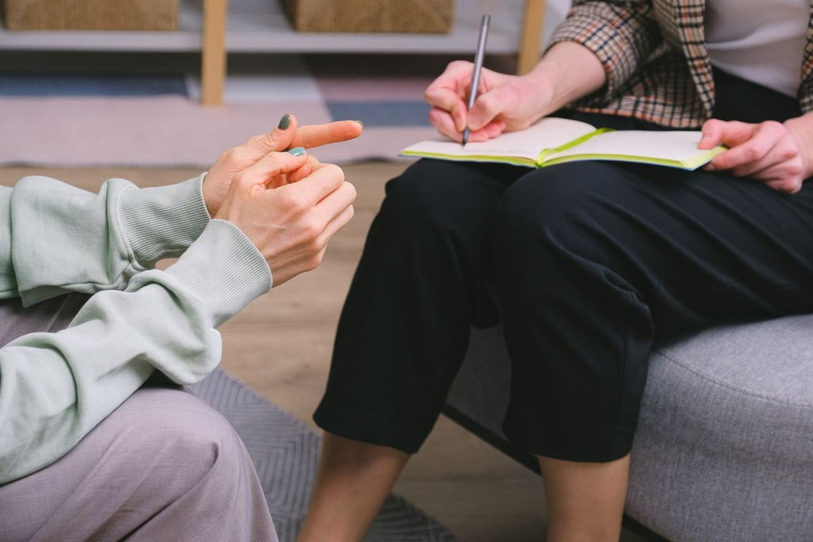 Therapist taking notes during a session