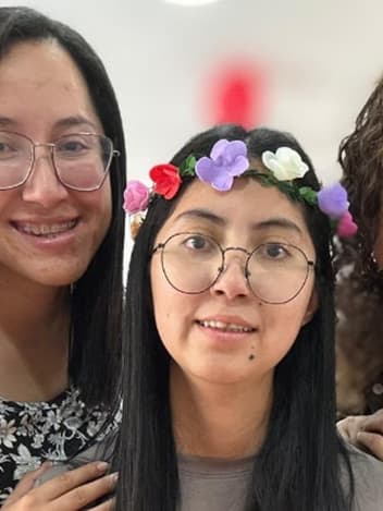 Three friends smiling together