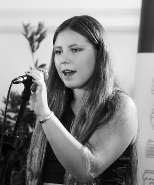 Young singer at the microphone