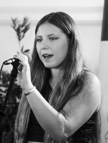 Young singer at the microphone