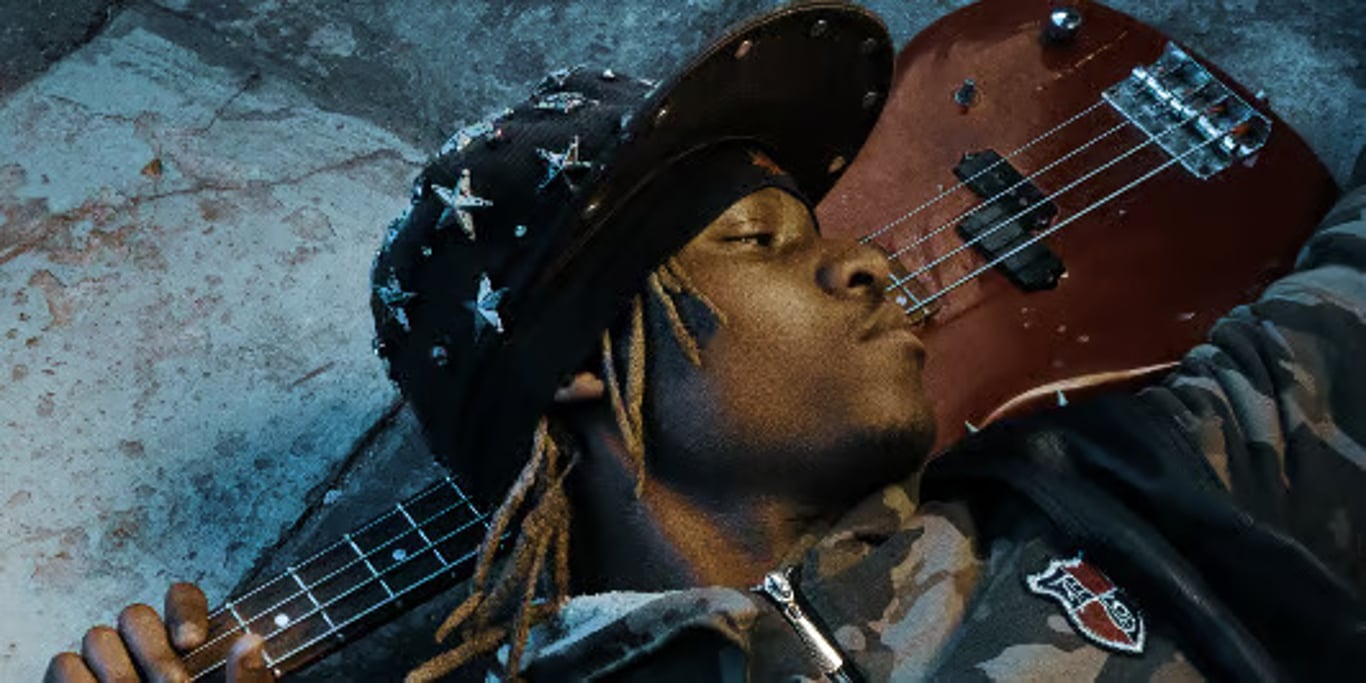 Bass player resting with his instrument
