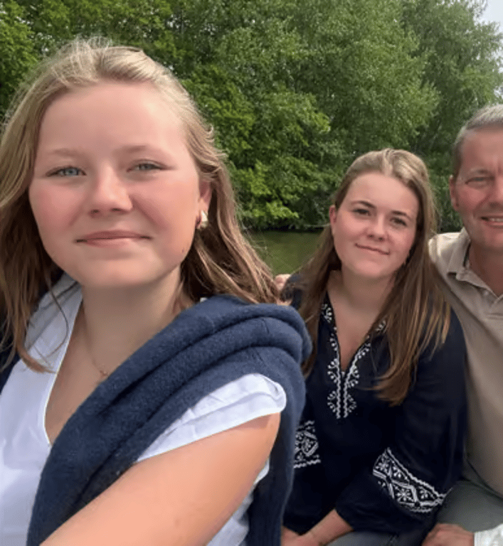 Family of four together outdoors