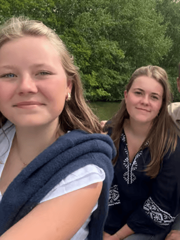 Family of four together outdoors