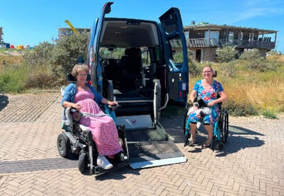 Wheelchair users boarding an accessible van