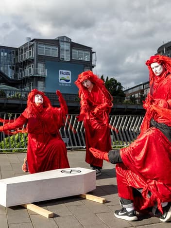 Red Rebel performers at a climate action