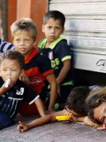 Children sheltering in a doorway