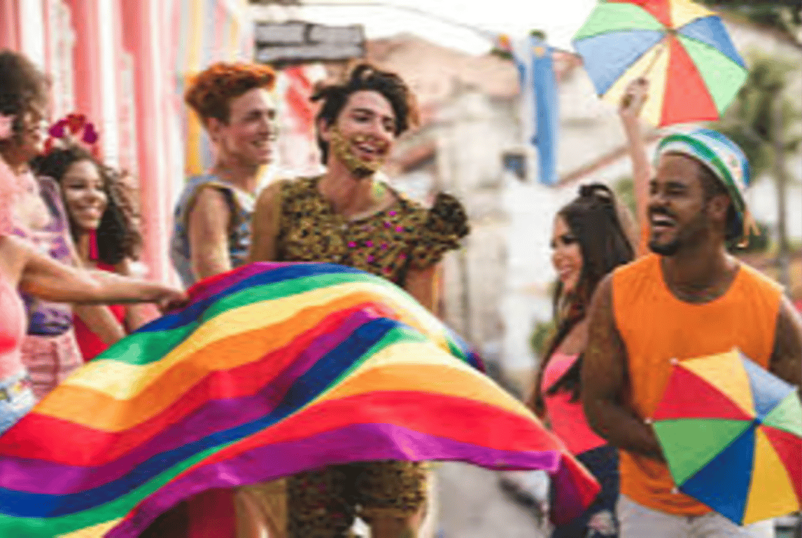 Friends celebrating with a rainbow flag