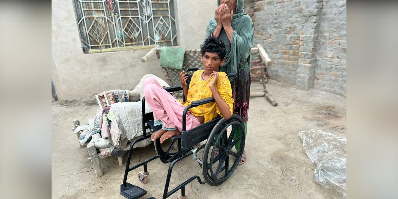 Young woman in a wheelchair with her mother