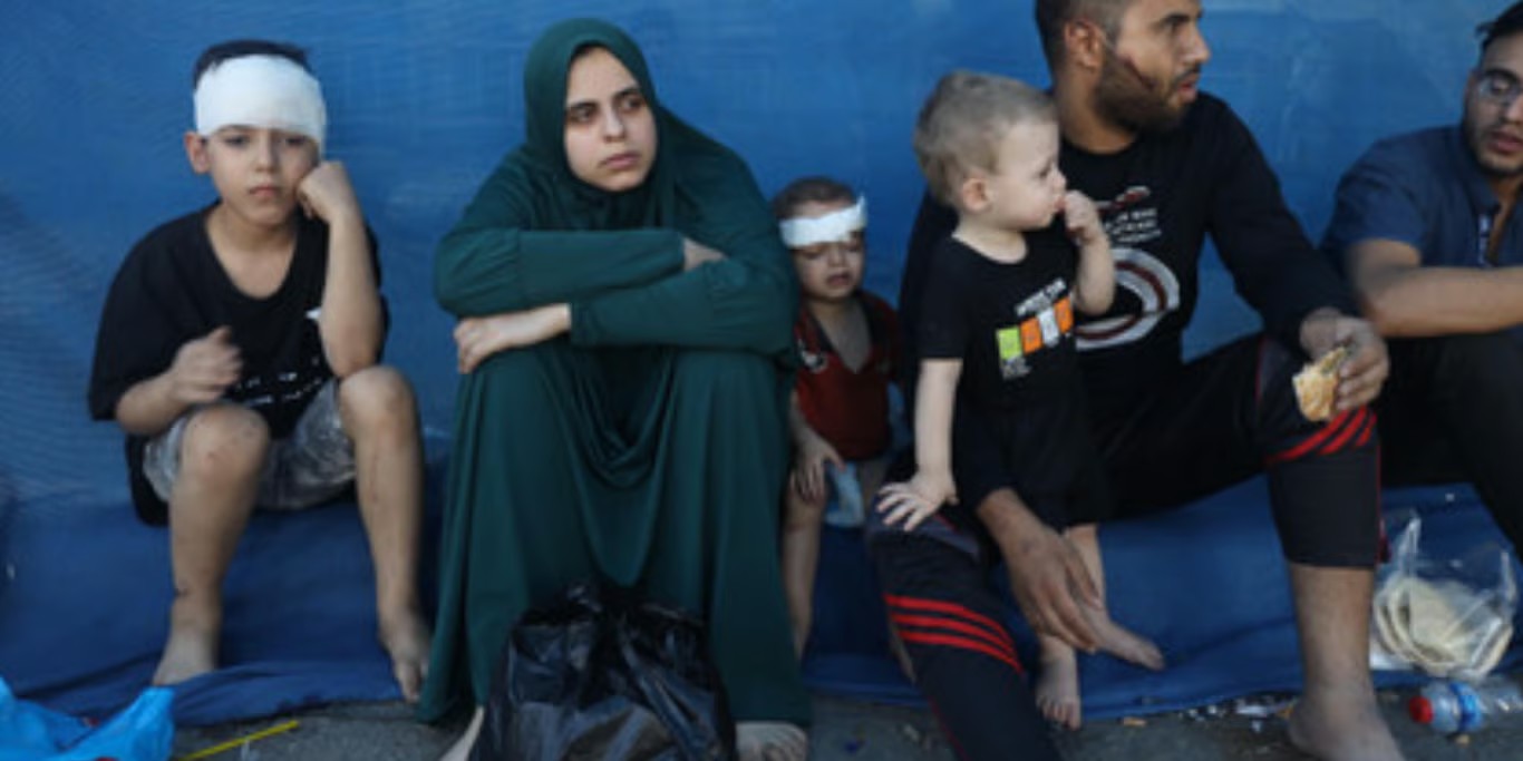 Displaced family waiting for aid