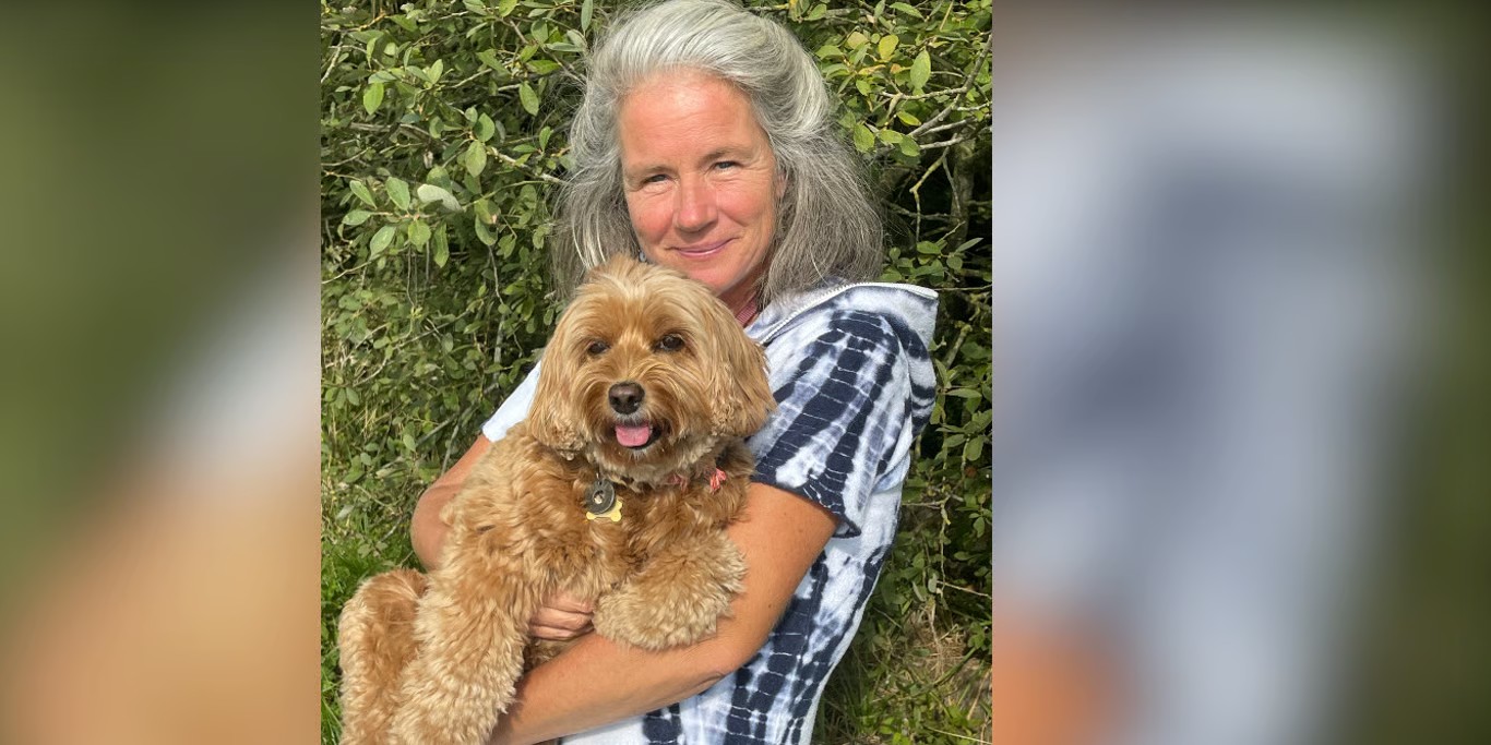 Woman hugging her dog