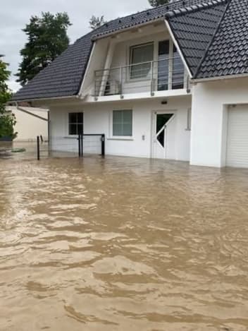 House surrounded by floodwater