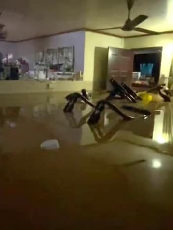 Flooded living room at night
