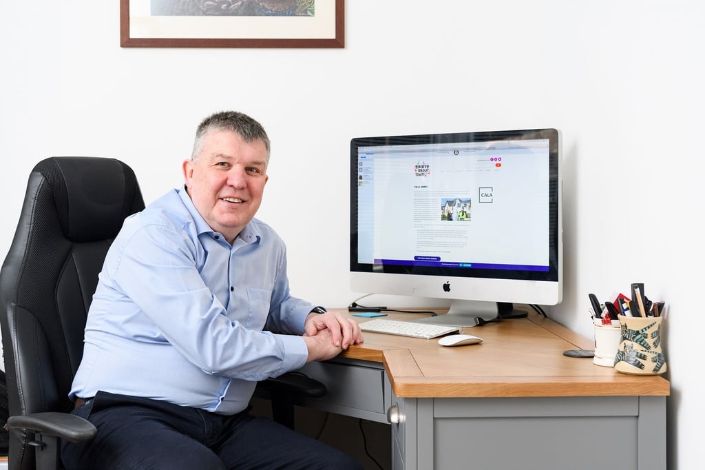 PR agency Edinburgh photography, John Evans of Waterfront Plaza in his home office