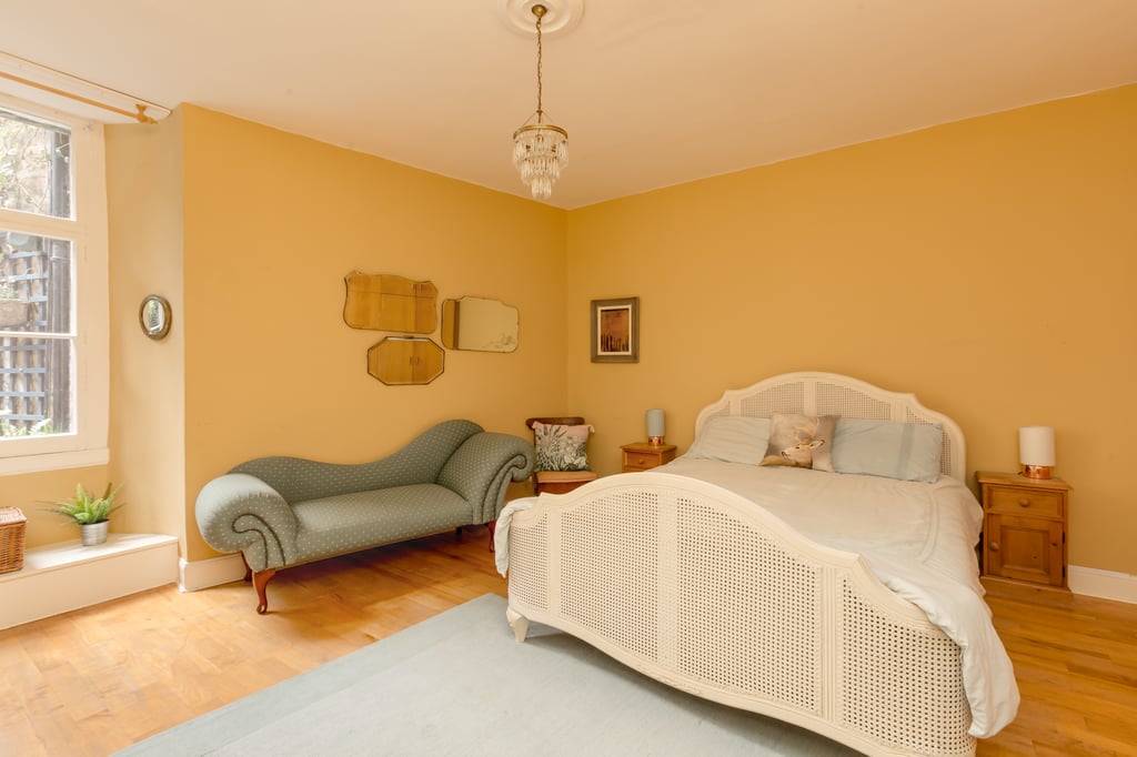PR Scotland photography shows master bedroom of city centre Georgian garden flat