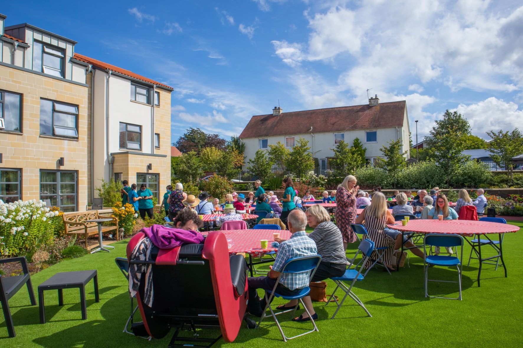 Guests enjoying event at Cramond Residence in the sunshine