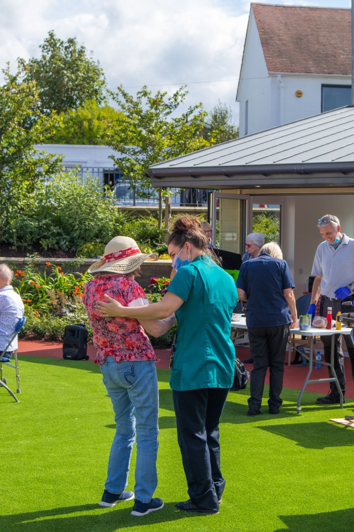 Cramond Resident dances with nurse in the sun