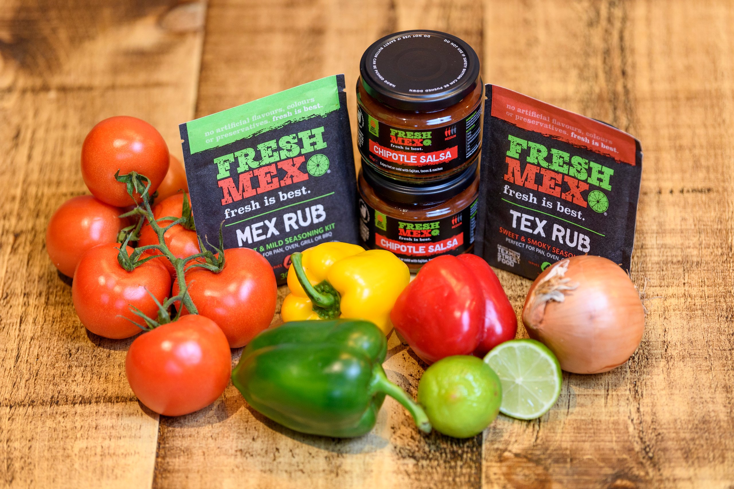FreshMex retail products alongside fresh vegetables used in their restaurant