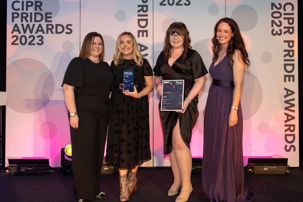 Staff with award winning PR agency Holyrood on stage to collect gold awards award at the 2023 CIPR Scotland PRide awards.