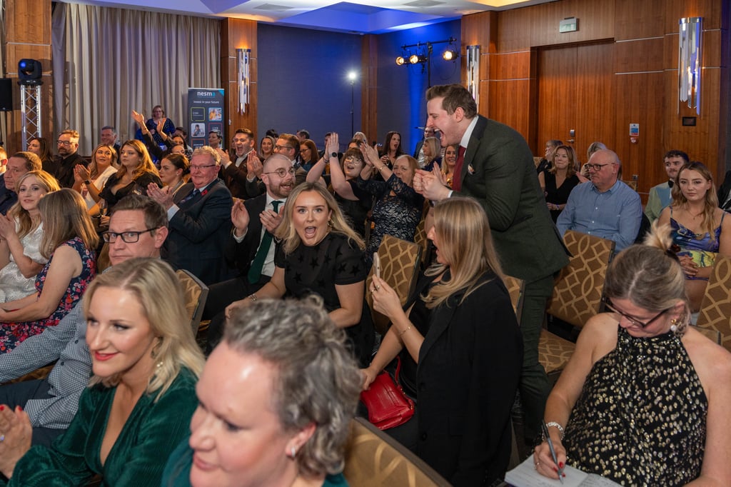 Staff with award winning PR agency Holyrood on stage to collect gold awards award at the 2023 CIPR Scotland PRide awards.