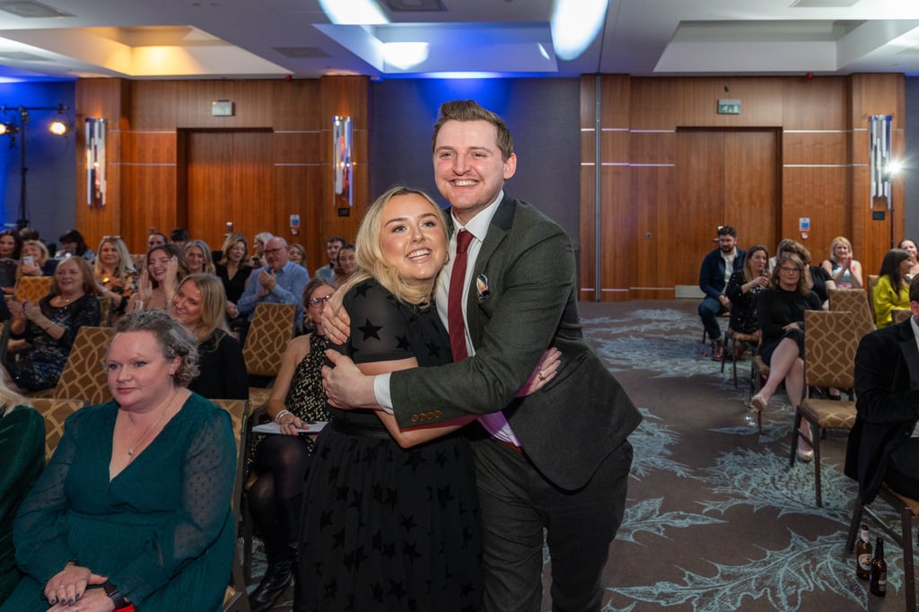 Staff with award winning PR agency Holyrood on stage to collect gold awards award at the 2023 CIPR Scotland PRide awards.