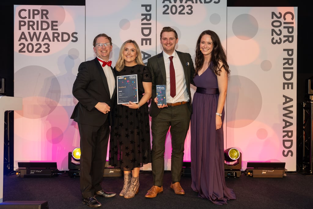 Staff with award winning PR agency Holyrood on stage to collect gold awards award at the 2023 CIPR Scotland PRide awards.