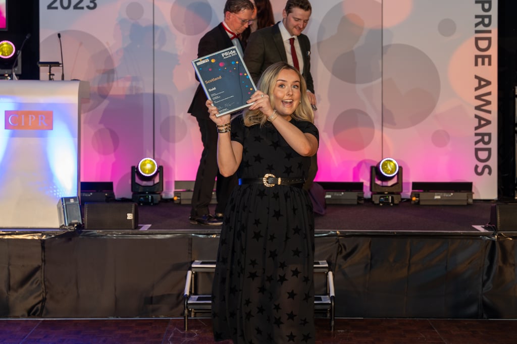 Account Executive Rachael Martin collecting gold award for best long-term client care with Holyrood PR client Paths For All.