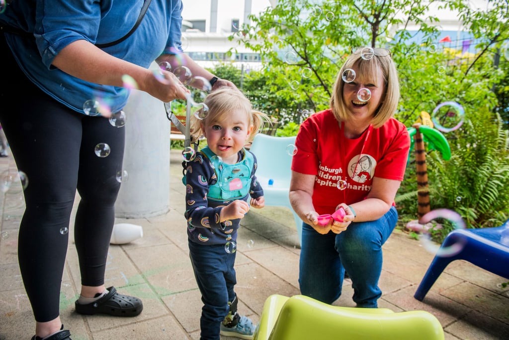 Child playing outside ECHC Hospital Hub. Credit Chris Watt Photography image used