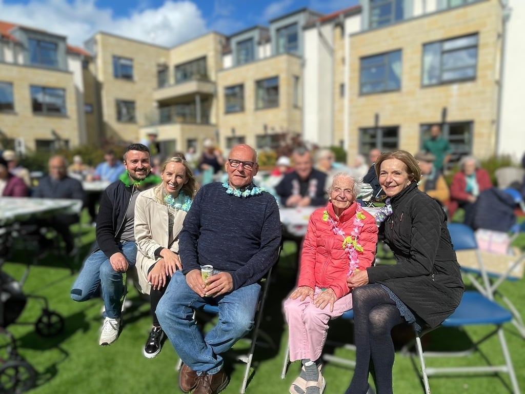 A resident and their family at Cramond's annual charity party | Social Care PR