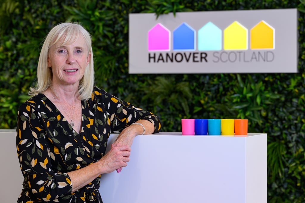 Angela Currie in front of Hanover Scotland sign wall | Scottish PR