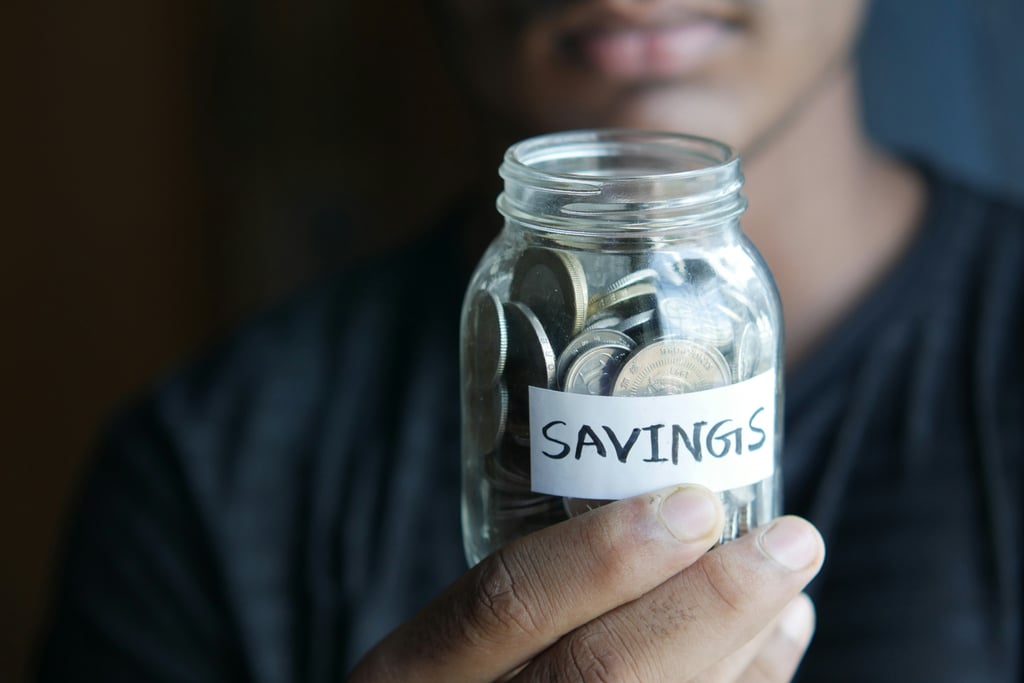 Jar of coins with label Savings