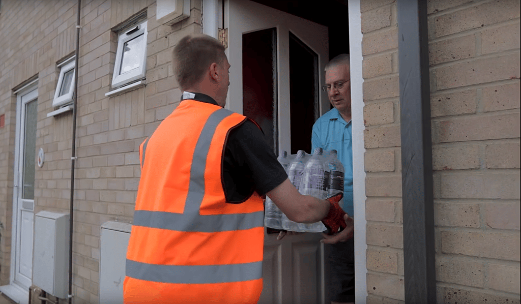 PR Photography of Water Direct's emergency water delivery to residents' door