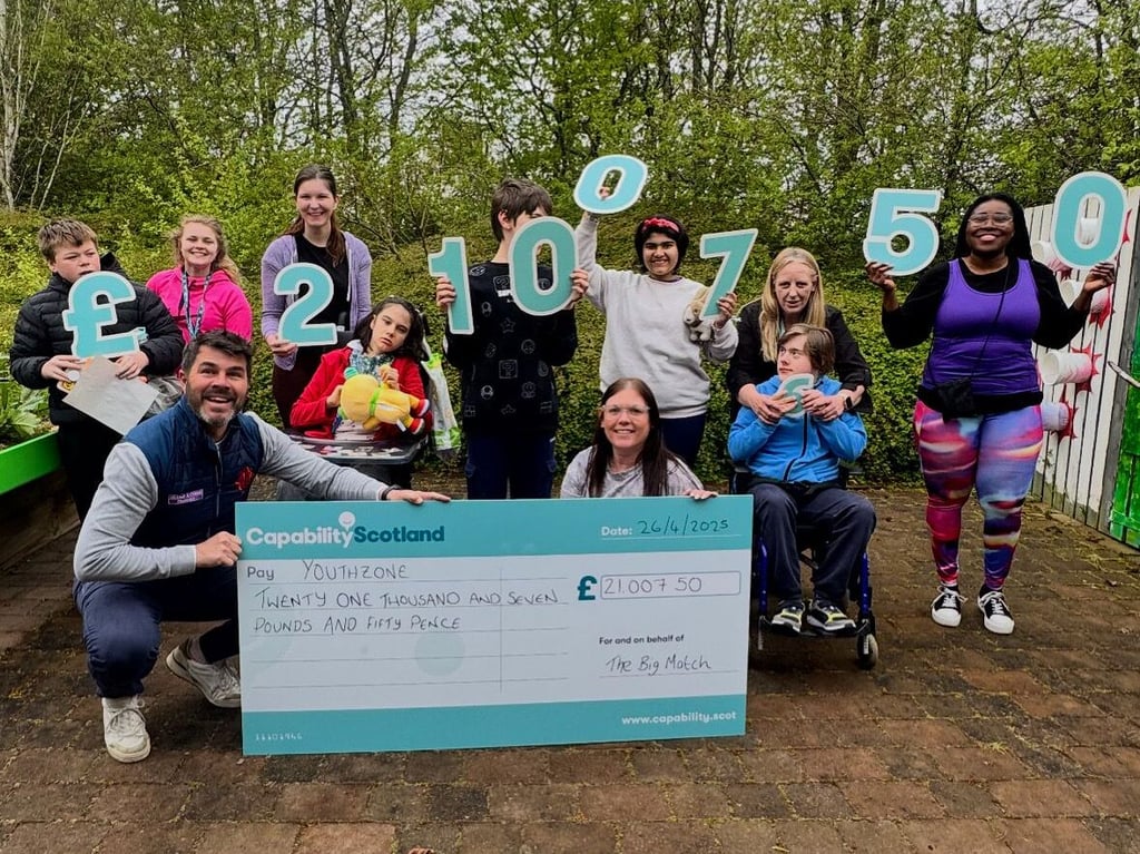 Steve Currie with final money raised for Capability Scotland | Charity PR