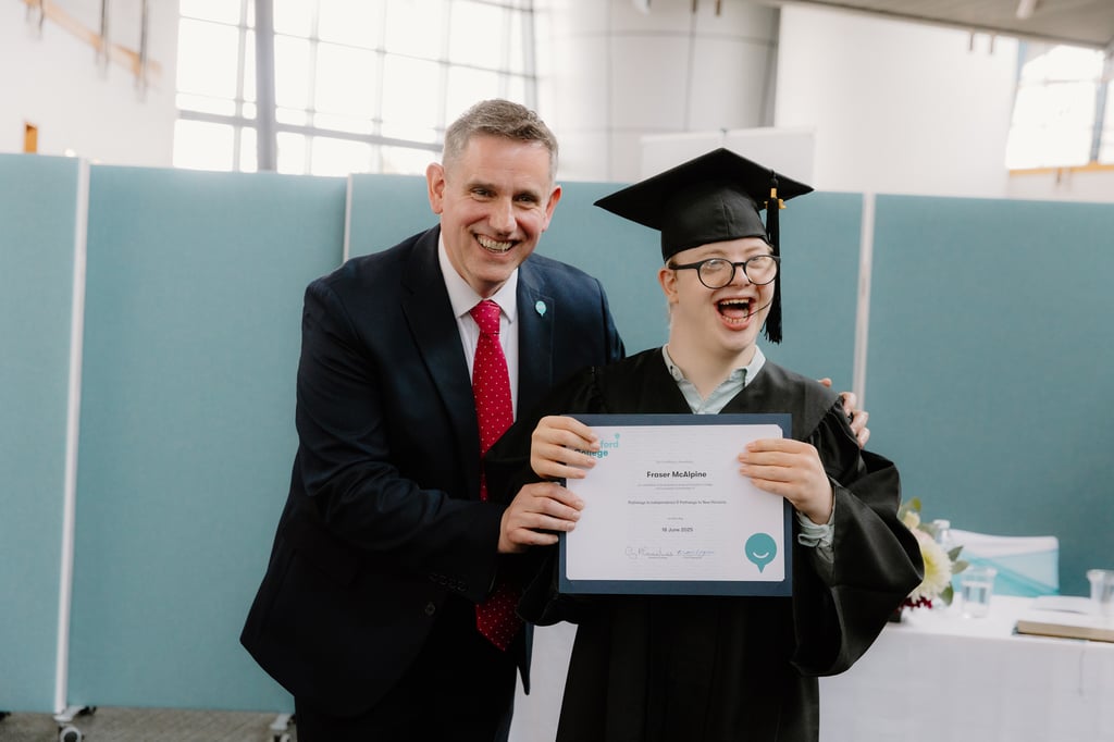 CEO of Capability Scotland Brian Logan celebrates with student Fergus McAlpine on his graduation from Corseford College, as showcased by Charity PR.