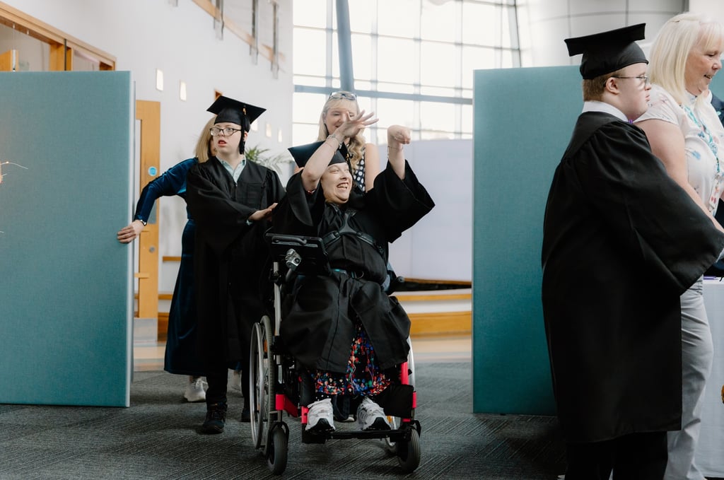 Student at Corseford College Sophie James-Rae celebrates after graduating from the complex needs college. On her left she is joined by fellow students, Fergus McAlpine and on her right, Darren Fitzpatrick, as showcased by Charity PR.