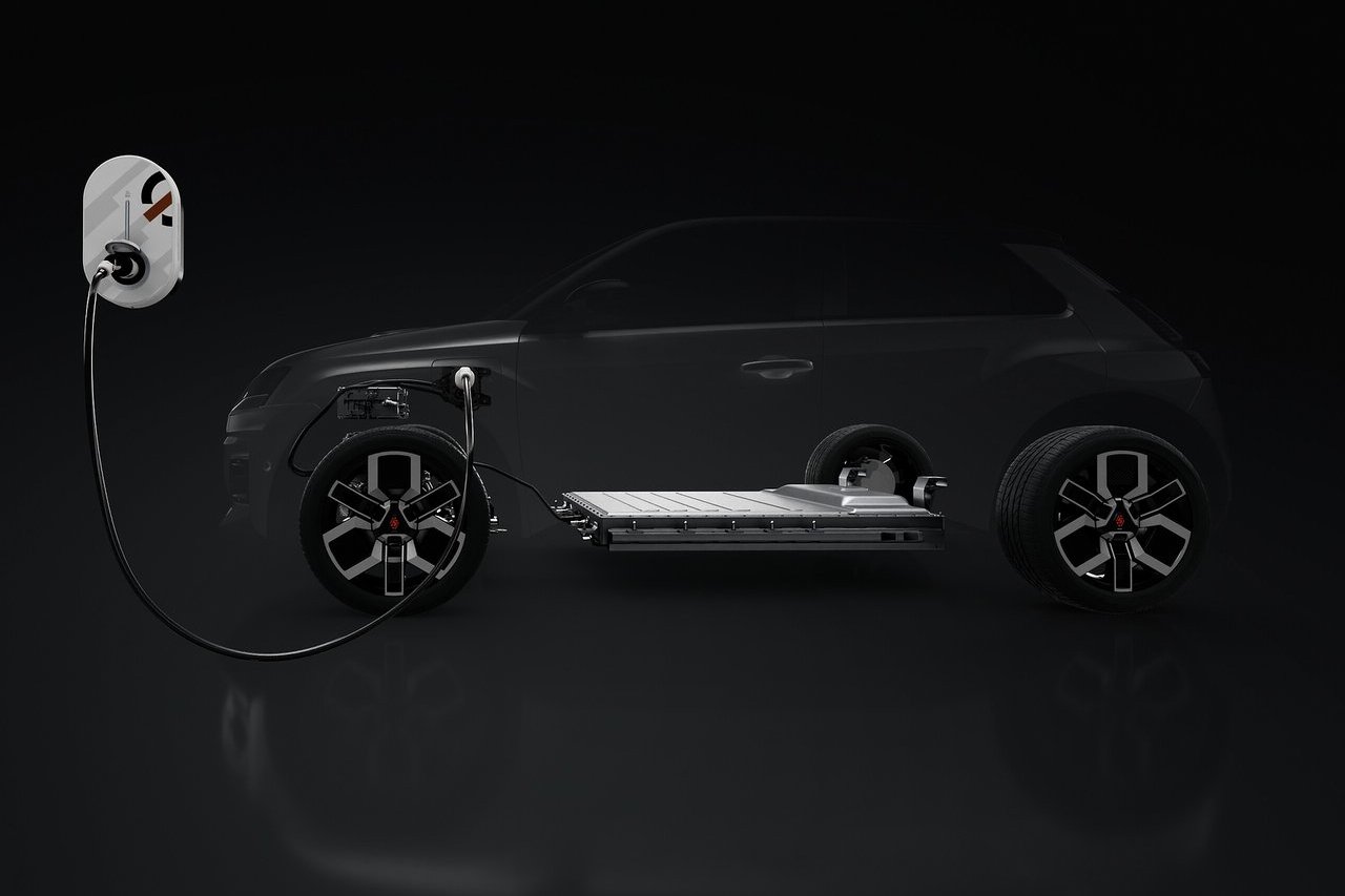 A visual representation of the Renault 5’s electric architecture, showing the battery placement and charging system within a semi-transparent outline of the vehicle.