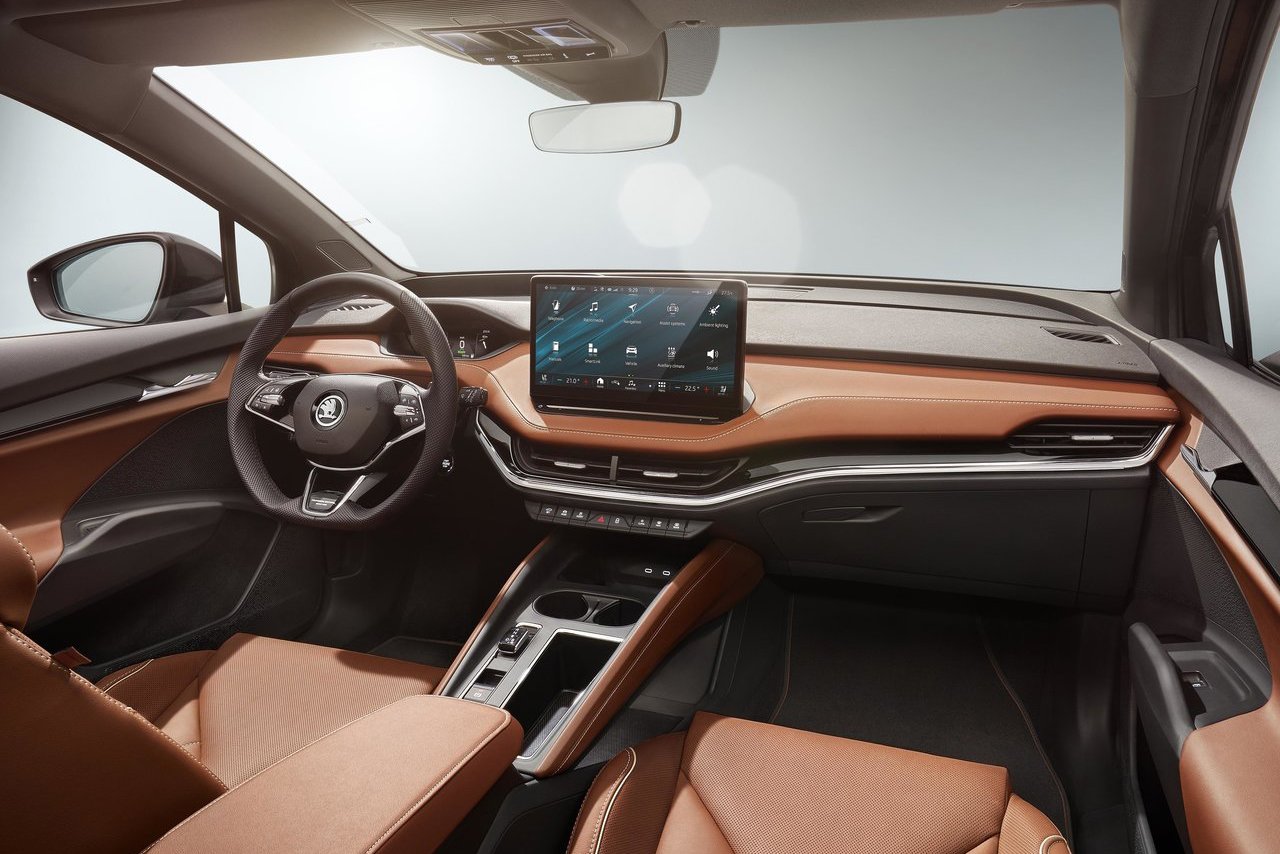 Luxurious interior of the Skoda Enyaq, featuring a modern dashboard with a large touchscreen display and premium materials for ultimate comfort.
