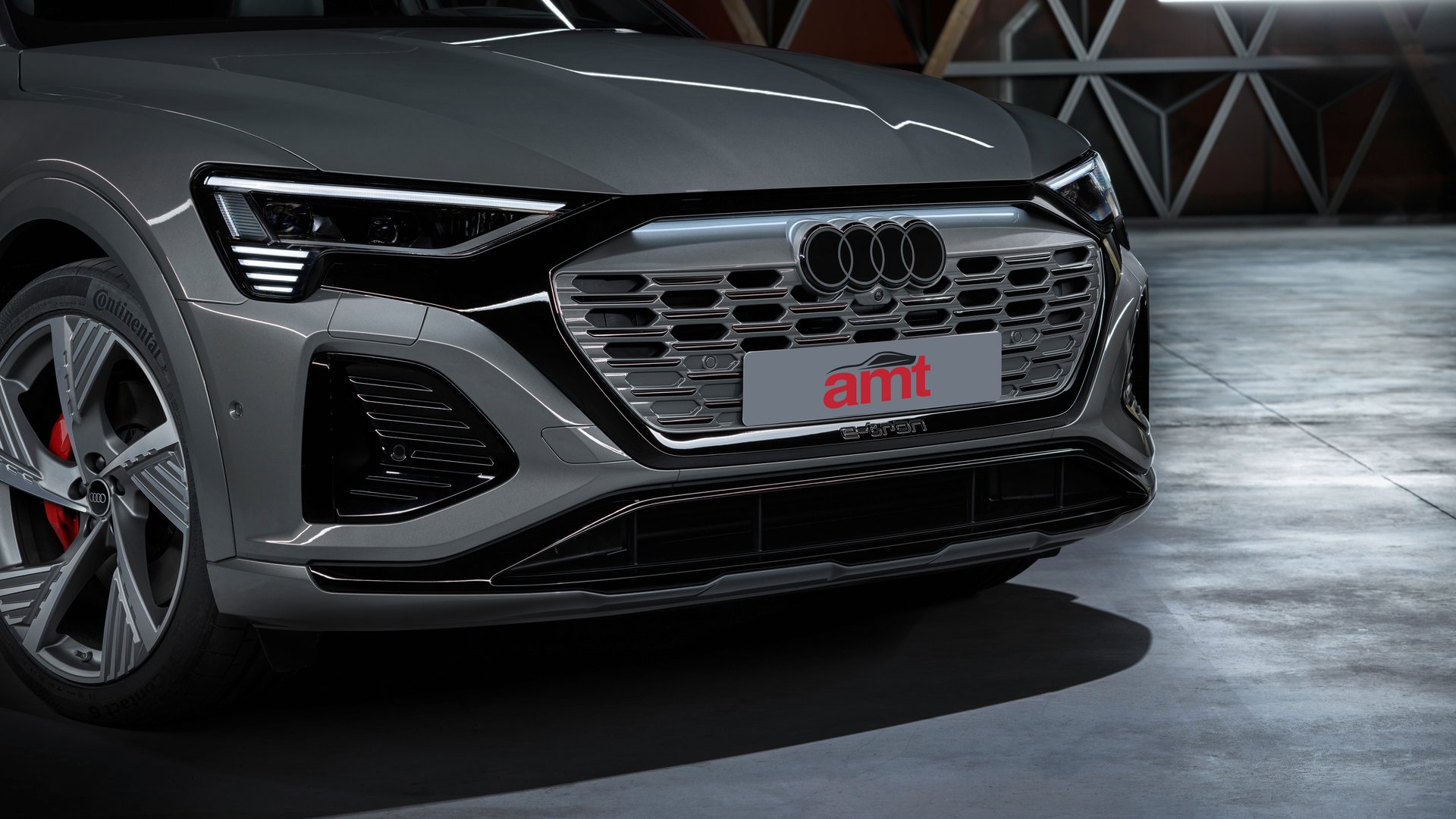 Front view of the Audi Q8 E-Tron showcasing its distinctive Singleframe grille and advanced LED Matrix headlights, designed for luxury and efficiency.