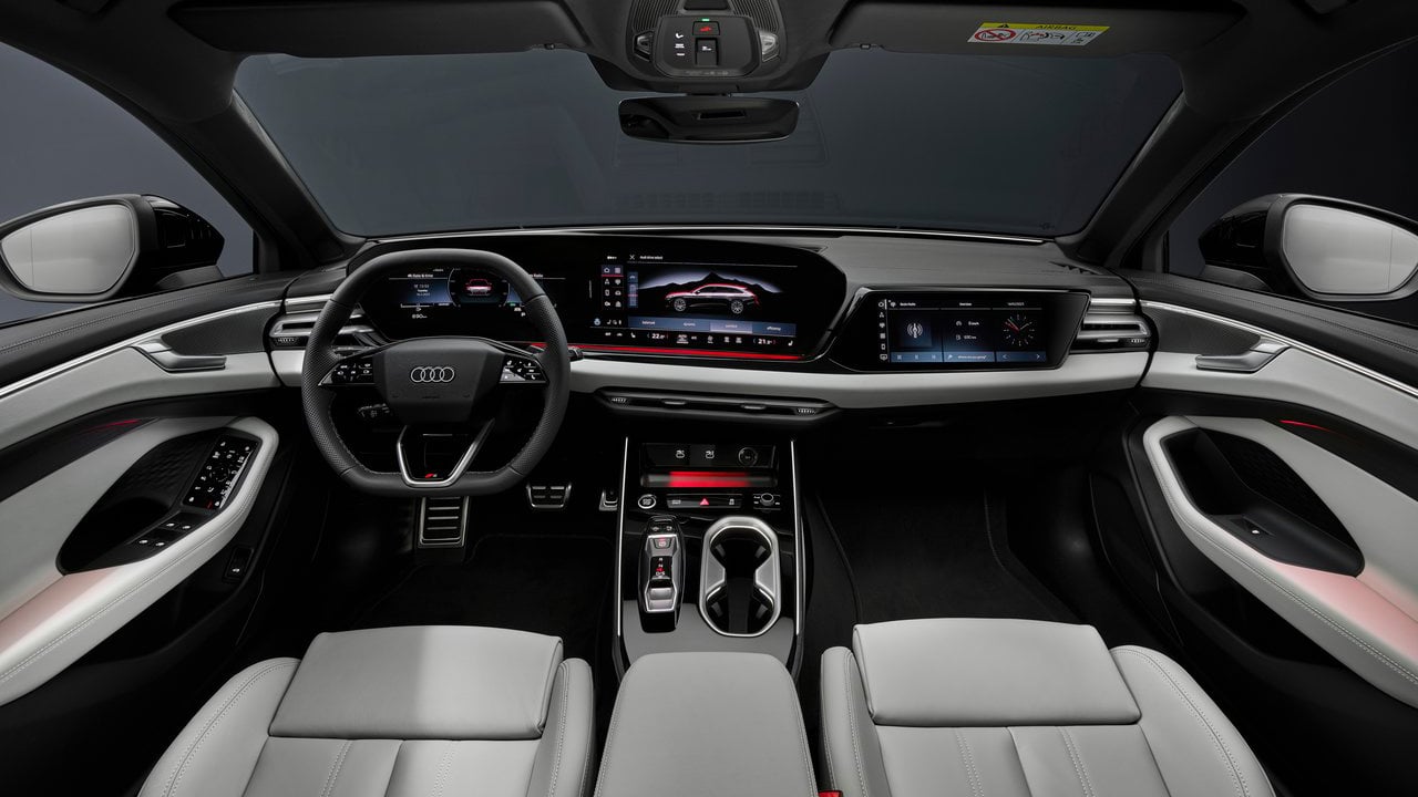 The luxurious interior of the Audi A6 Avant, featuring premium leather seats, a digital cockpit, and an advanced infotainment system.